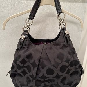 Classic Coach handbag in black signature print